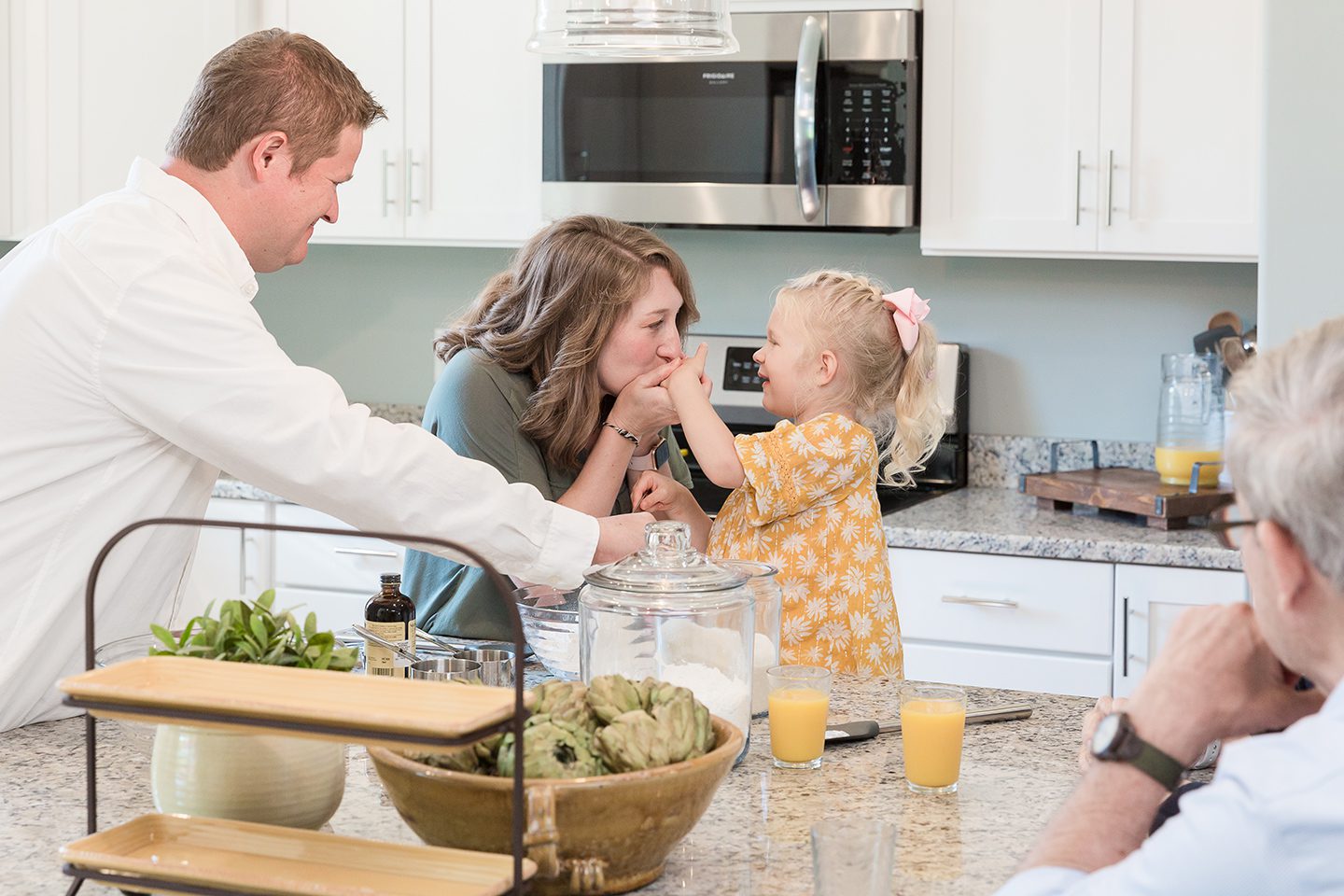 Rock River Homes family gathered in kitchen