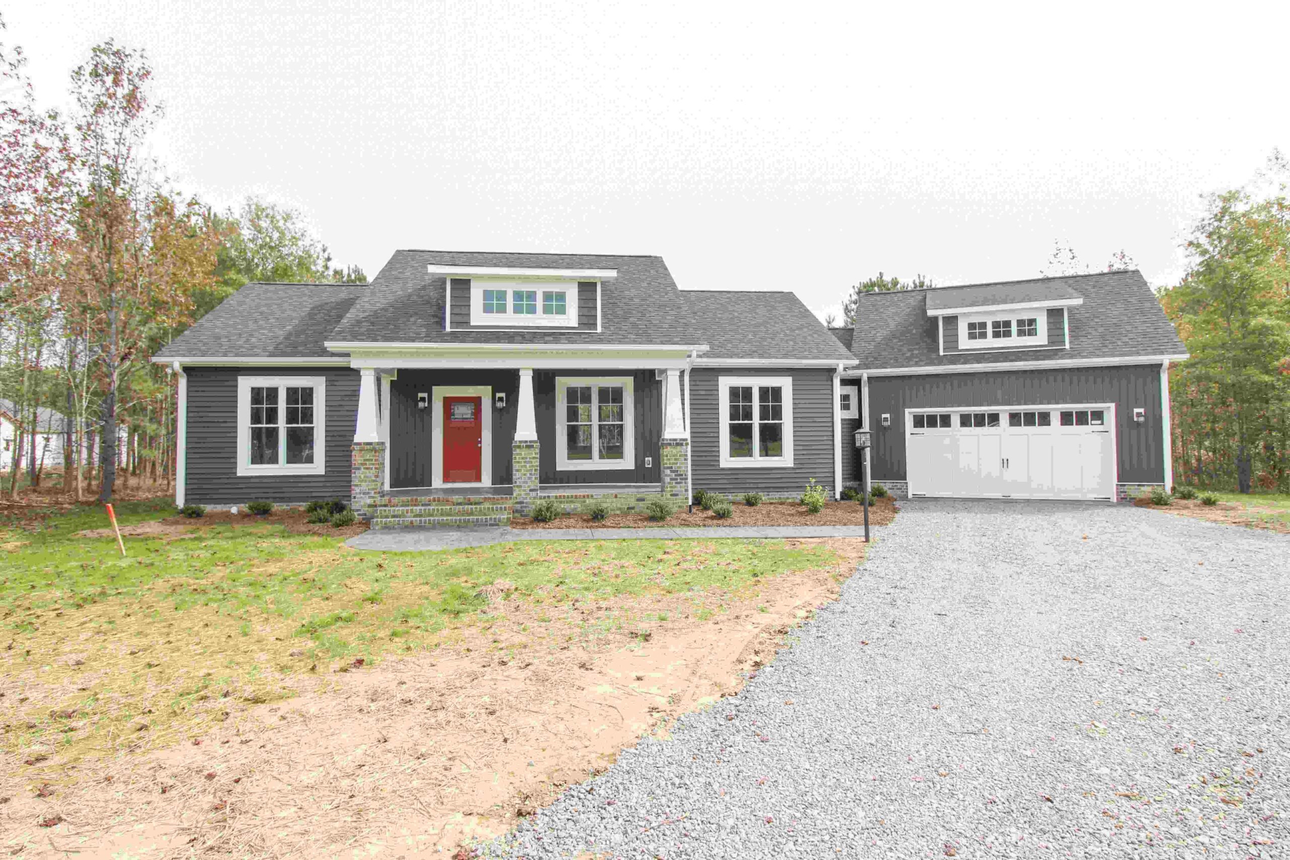 House with gray siding and garage