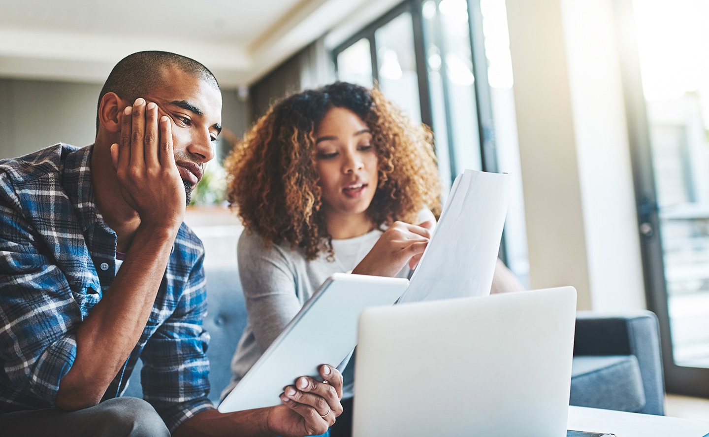 Couple looking at loan paperwork